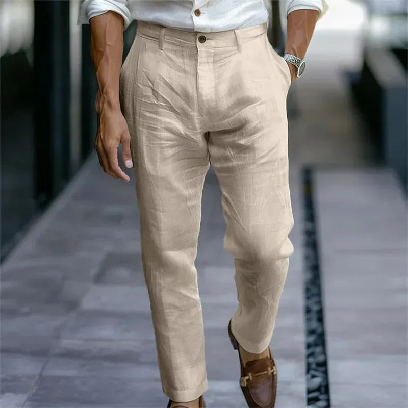 Beige pants worn by a person on a blurred background