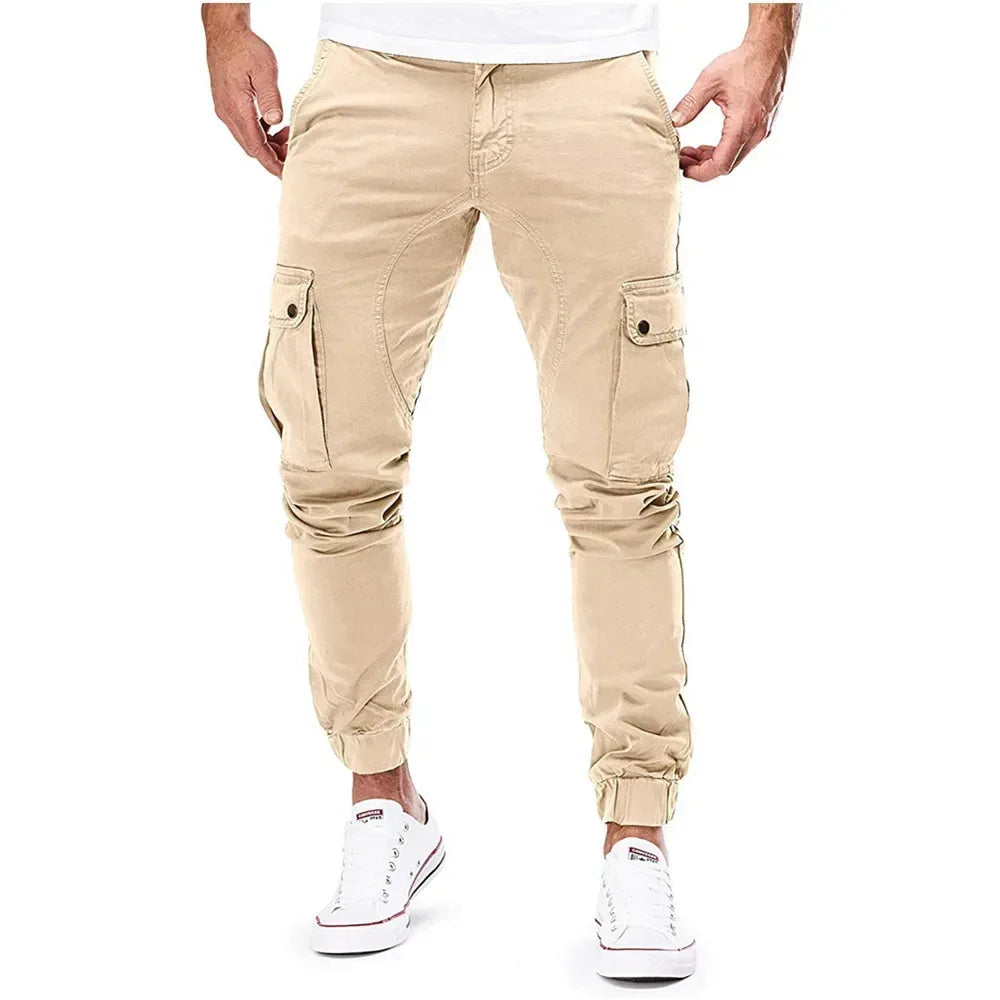 Beige cargo pants worn by a person on a white background