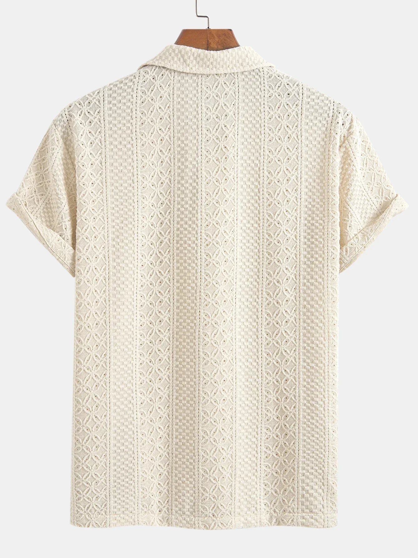 Beige patterned shirt on a hanger against a white background