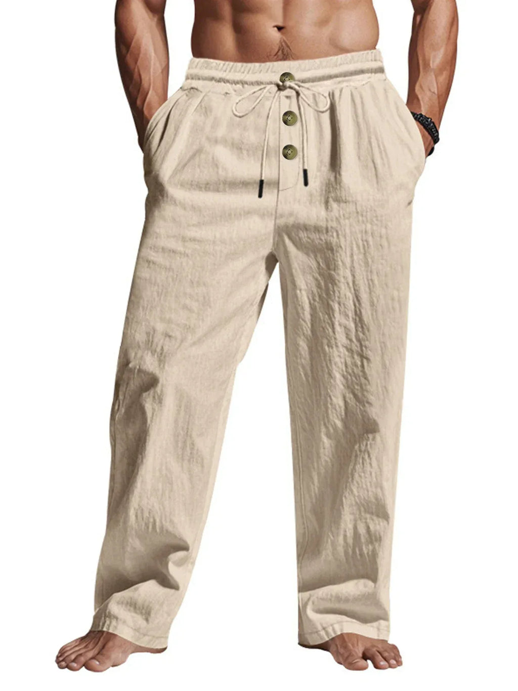 Beige linen pants with button details on a white background