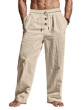 Beige linen pants with button details on a white background