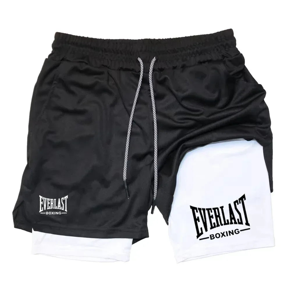 Black and white athletic shorts with Everlast Boxing logo on a white background