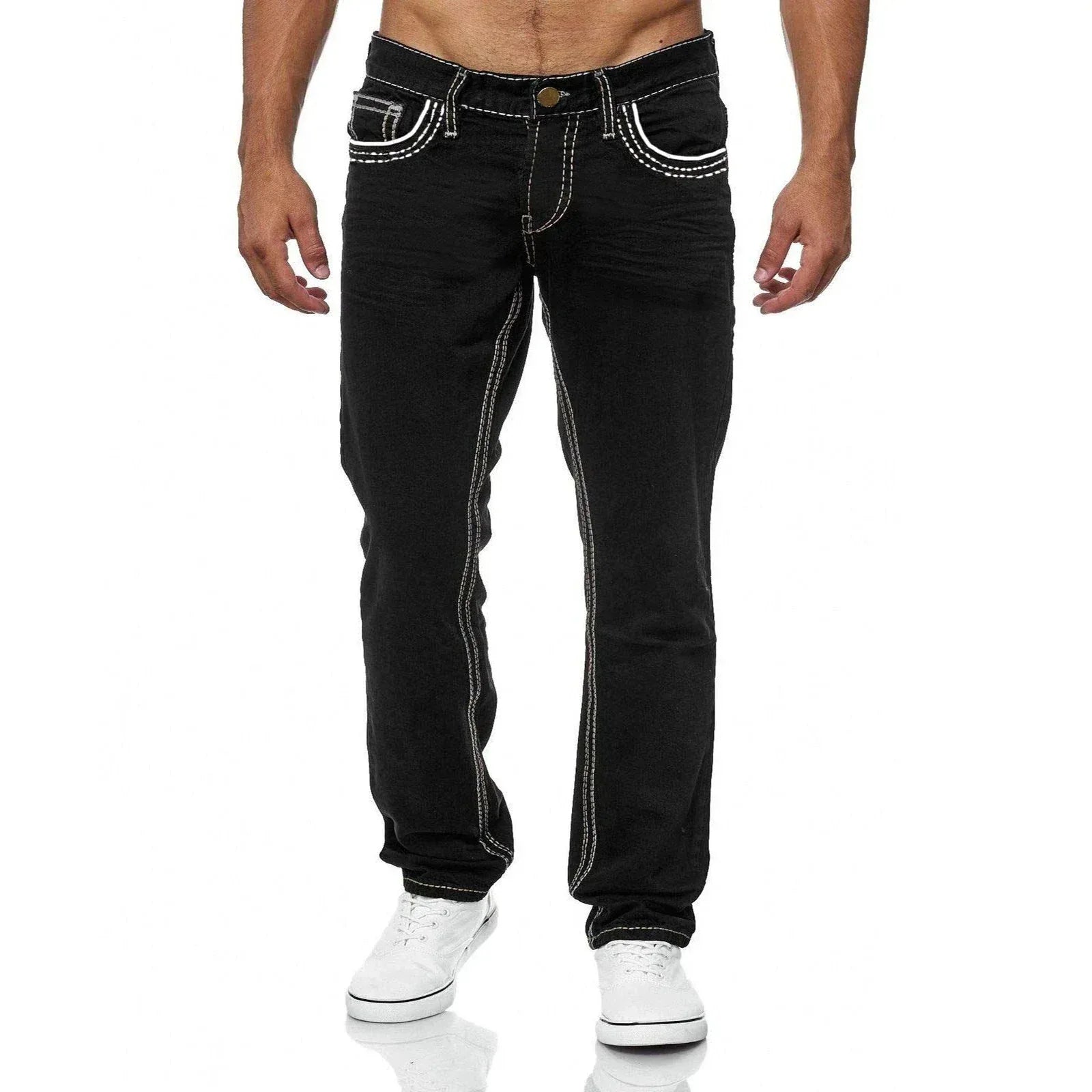 Black jeans with white stitching worn by a person on a white background