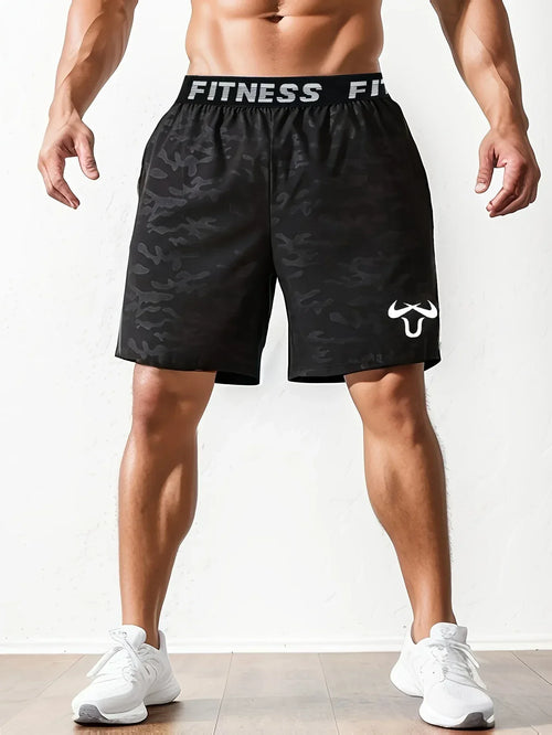 Black patterned fitness shorts with visible branding on a white background