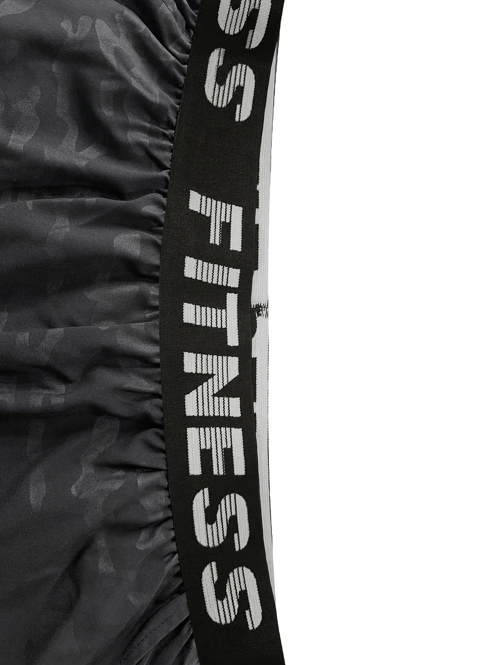 Black resistance band with 'SS Fitness' branding on a white background