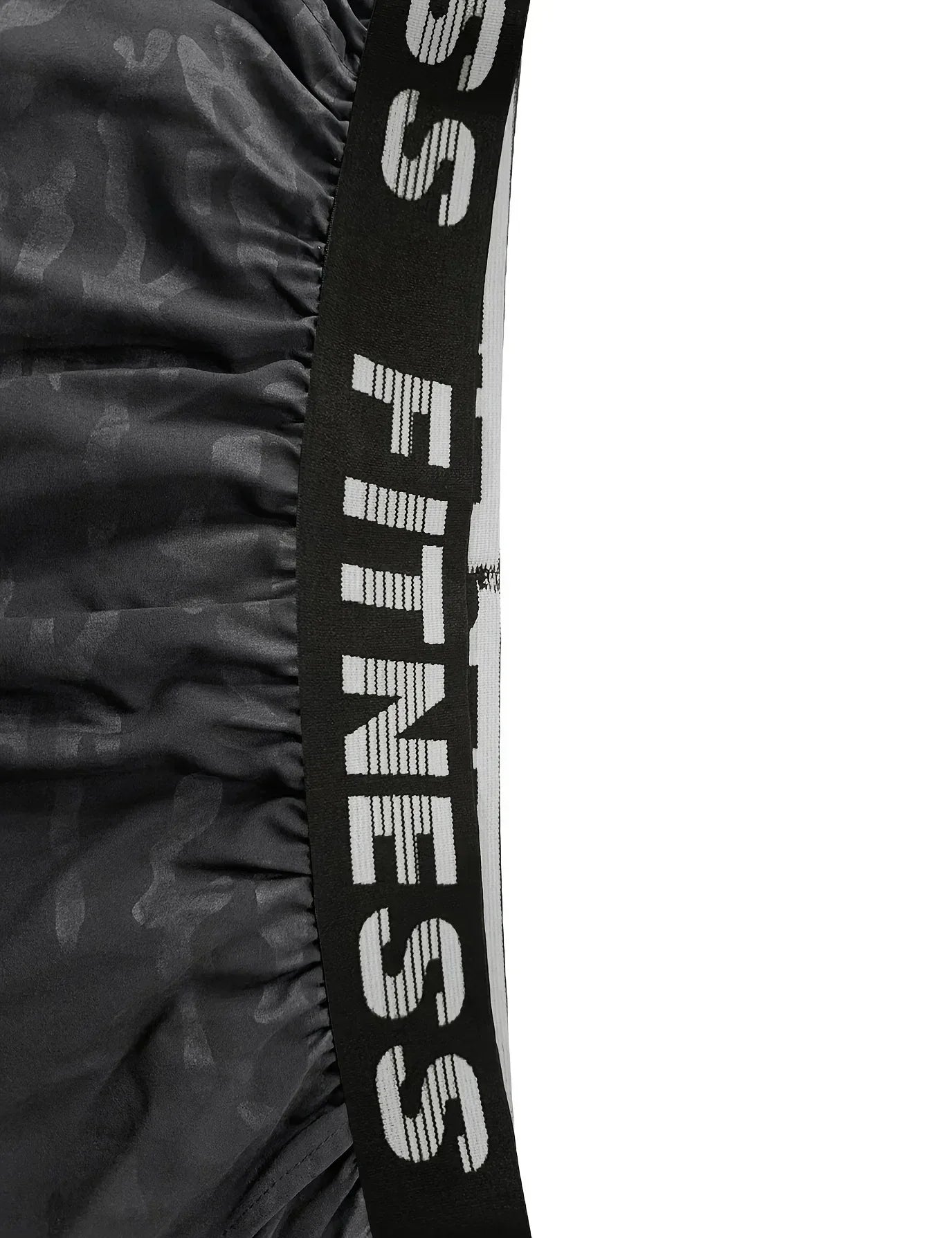 Black resistance band with 'SS Fitness' branding on a white background