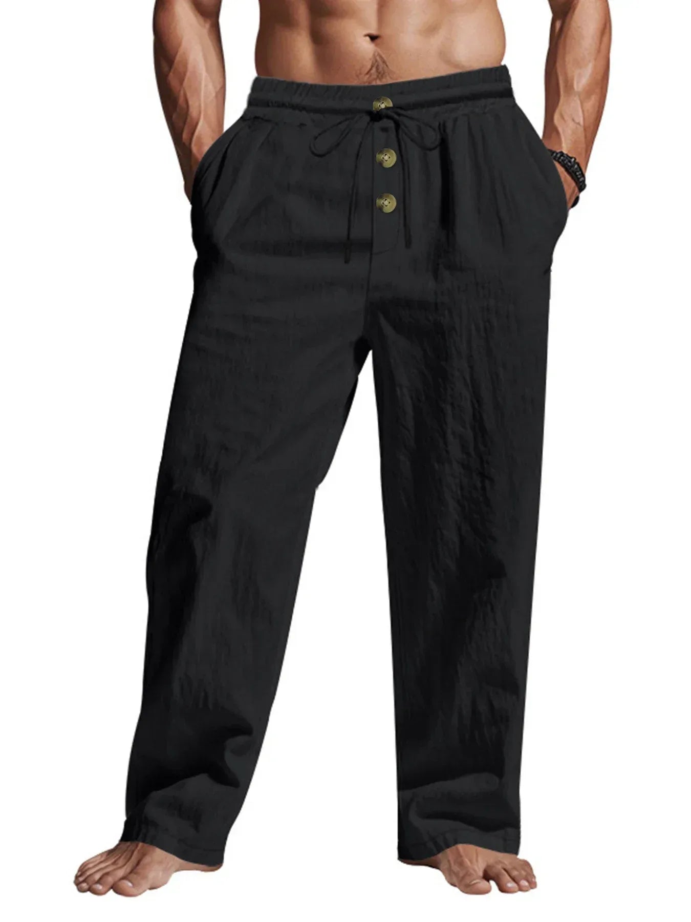 Black pants worn by a person on a white background
