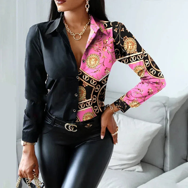 Woman wearing a black and pink patterned blouse with gold accents in a room.