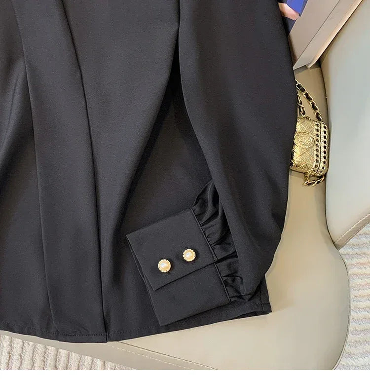 Black blazer with gold buttons on a mannequin