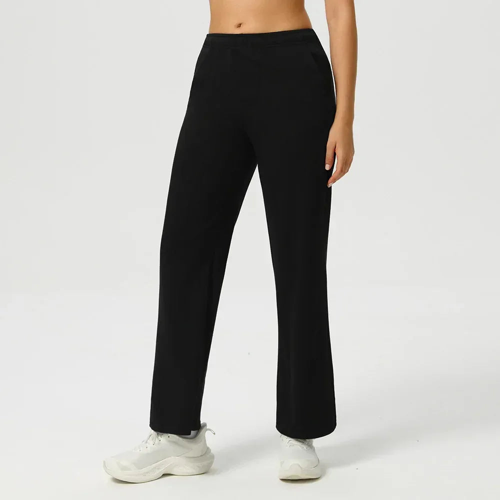 Black Front view of women's high-waisted baggy joggers featuring an oversized fit and functional deep pockets- BetterPlace
