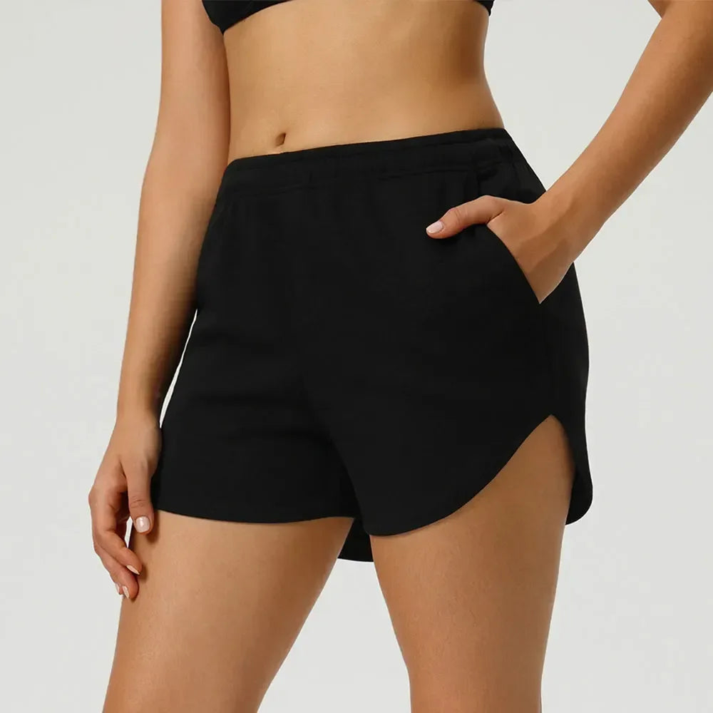 black Front view of women’s high-waisted elastic running shorts featuring a supportive tummy control waistband - BetterPlace