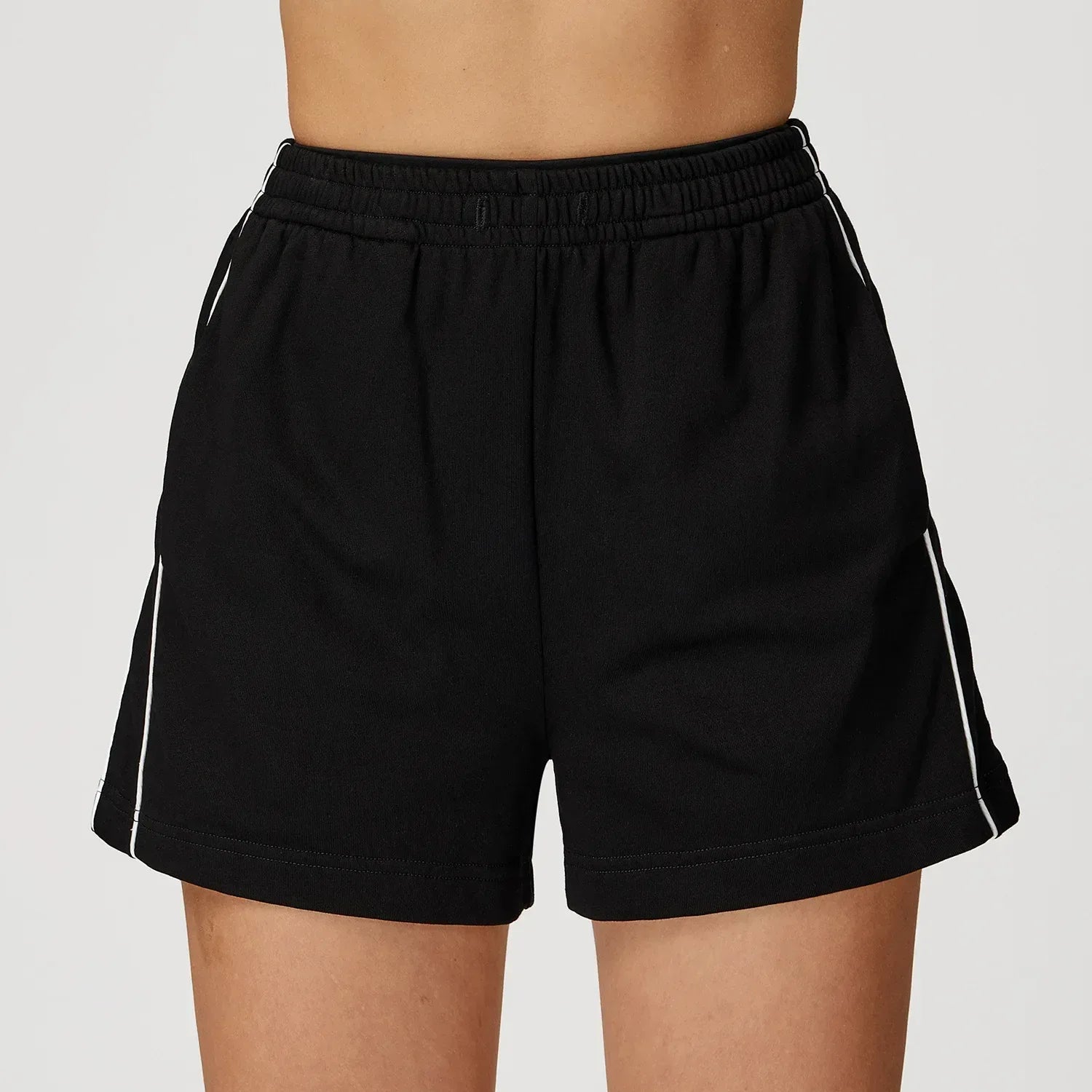 black Front view of women’s high-waisted loose pocket shorts in a breathable athletic fabric - BetterPlace