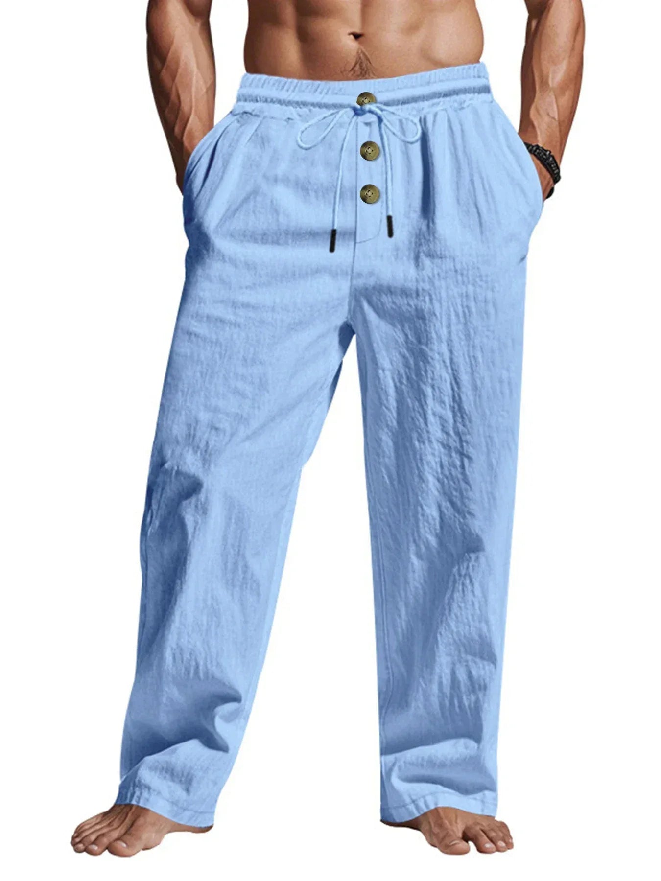 Light blue pants with button details worn by a person on a white background