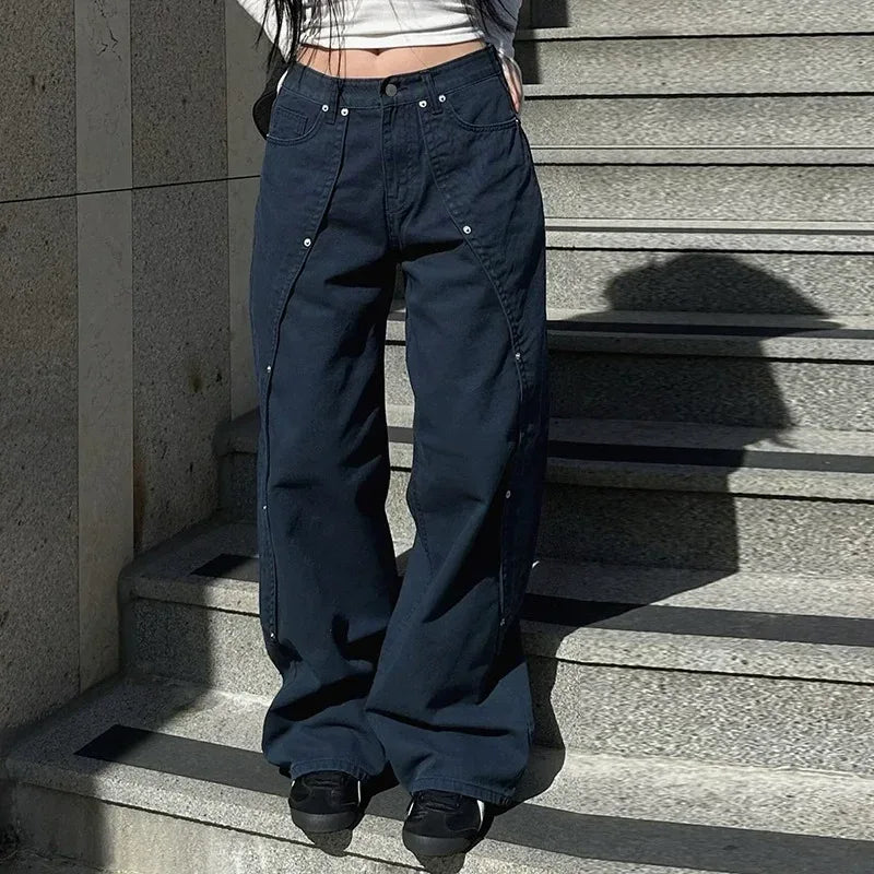 Person wearing navy blue cargo pants standing on a staircase.