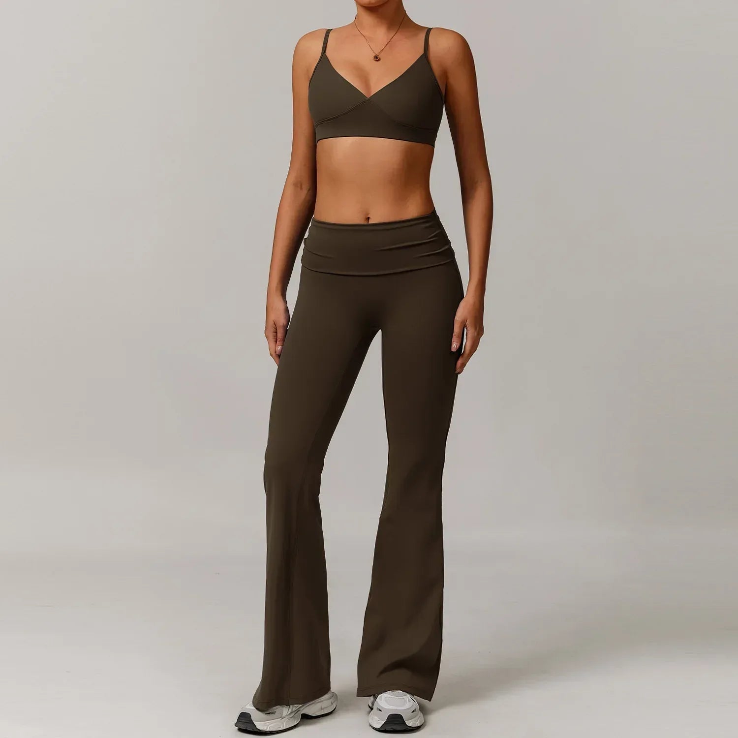 Two-piece brown activewear set featuring a push up sports bra and high-waisted wide leg pants in an earth tone.- BetterPlace