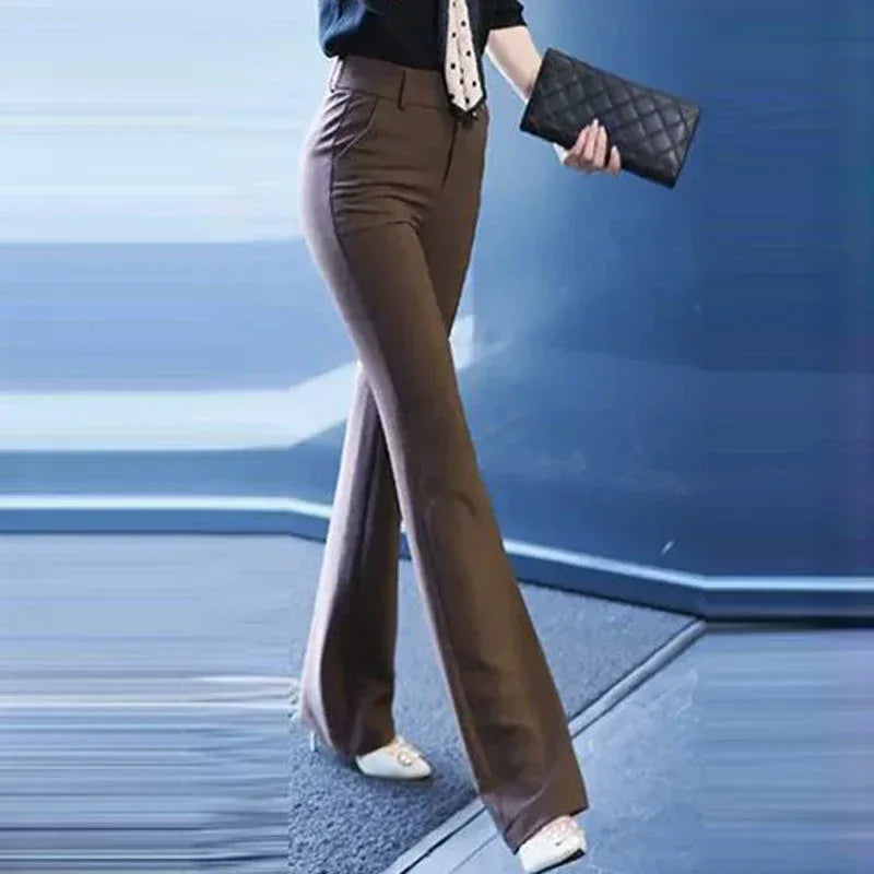 Person wearing brown bell-bottom pants with a blurred background