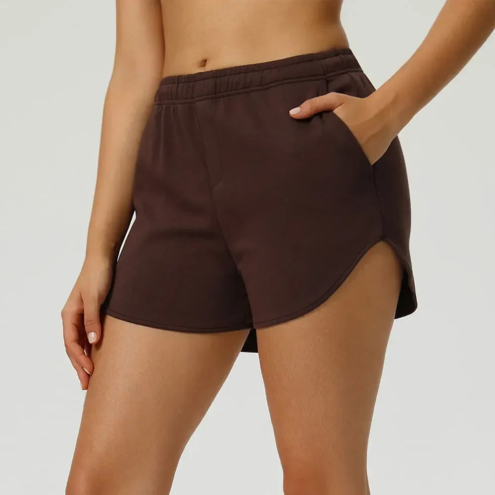 chocolate Front view of women’s high-waisted elastic running shorts featuring a supportive tummy control waistband - BetterPlace