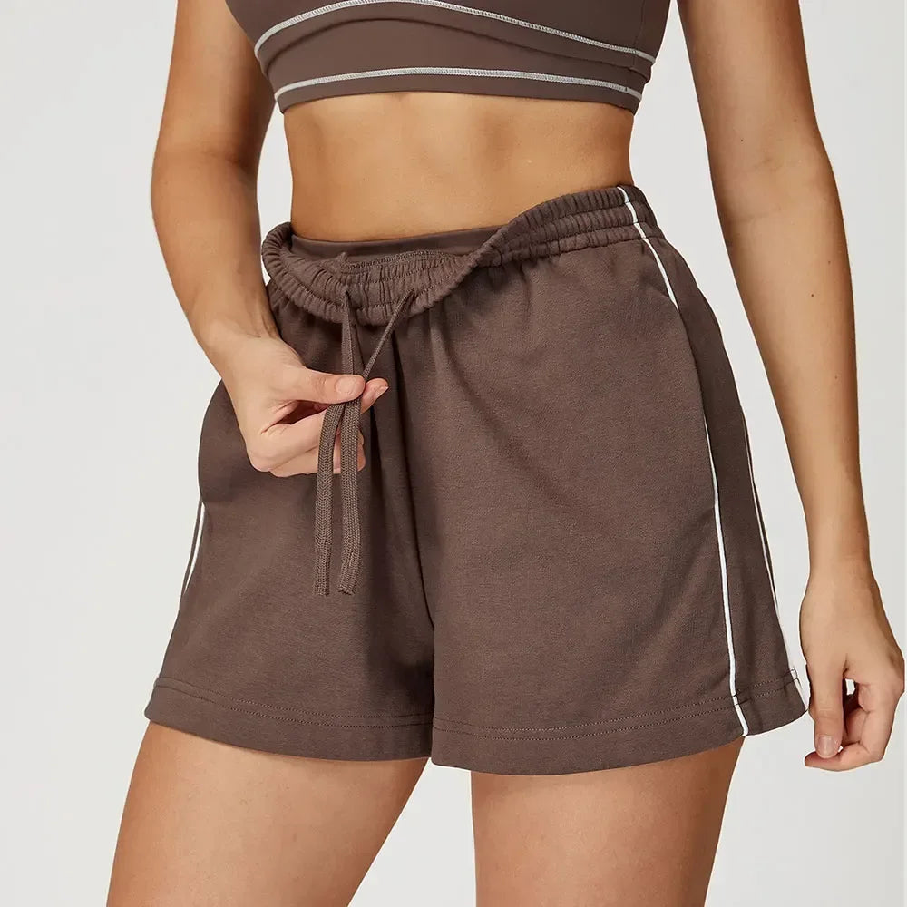 chocolate Front view of women’s high-waisted loose pocket shorts in a breathable athletic fabric- BetterPlace