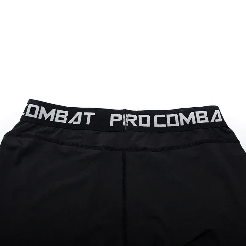 Black athletic shorts with 'Pro Combat' waistband on a white background
