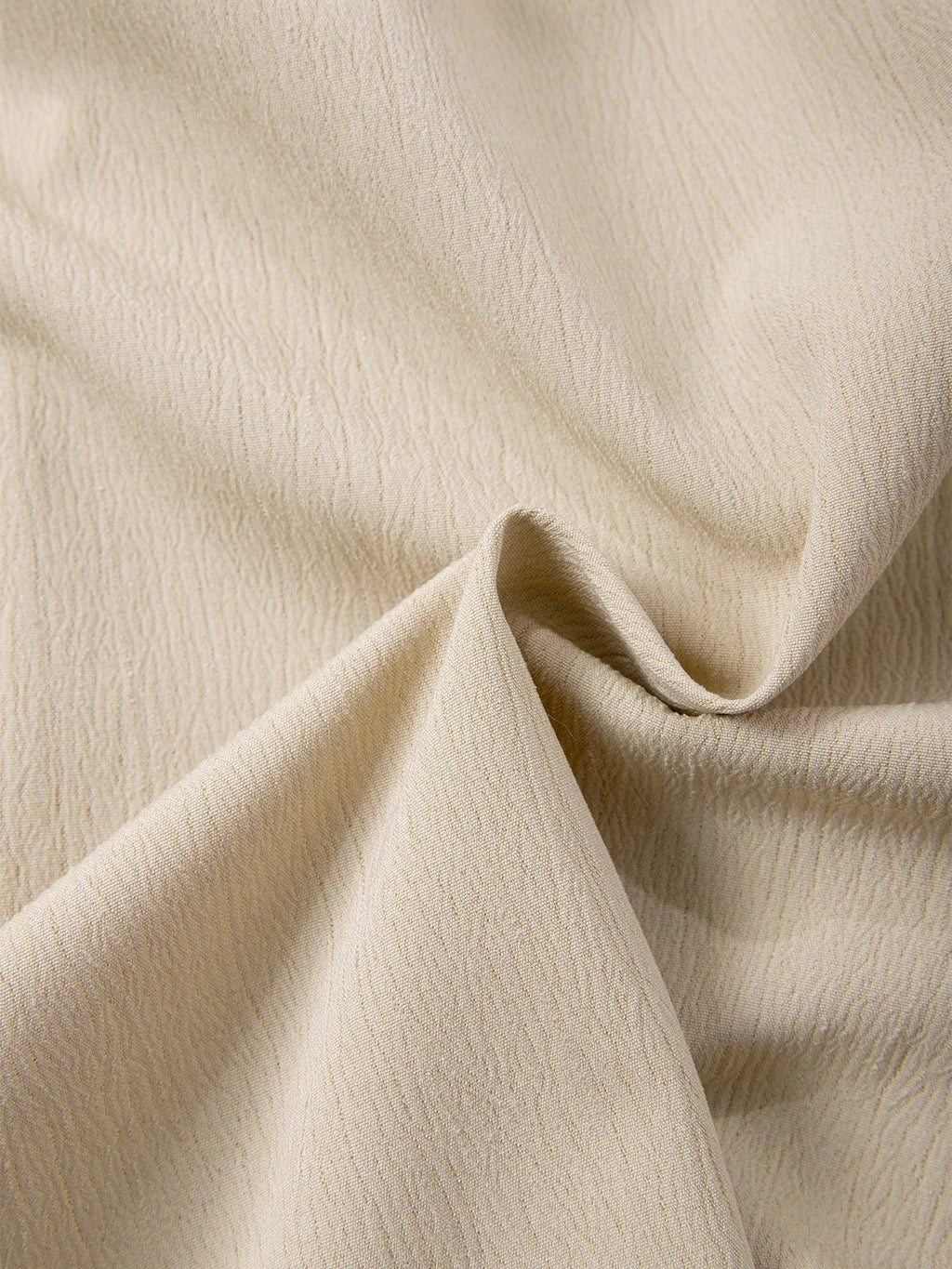Close-up of beige fabric with a soft texture