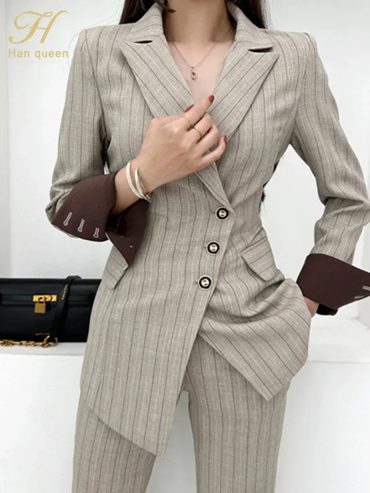 Woman wearing a gray pinstripe suit with a black handbag in the background