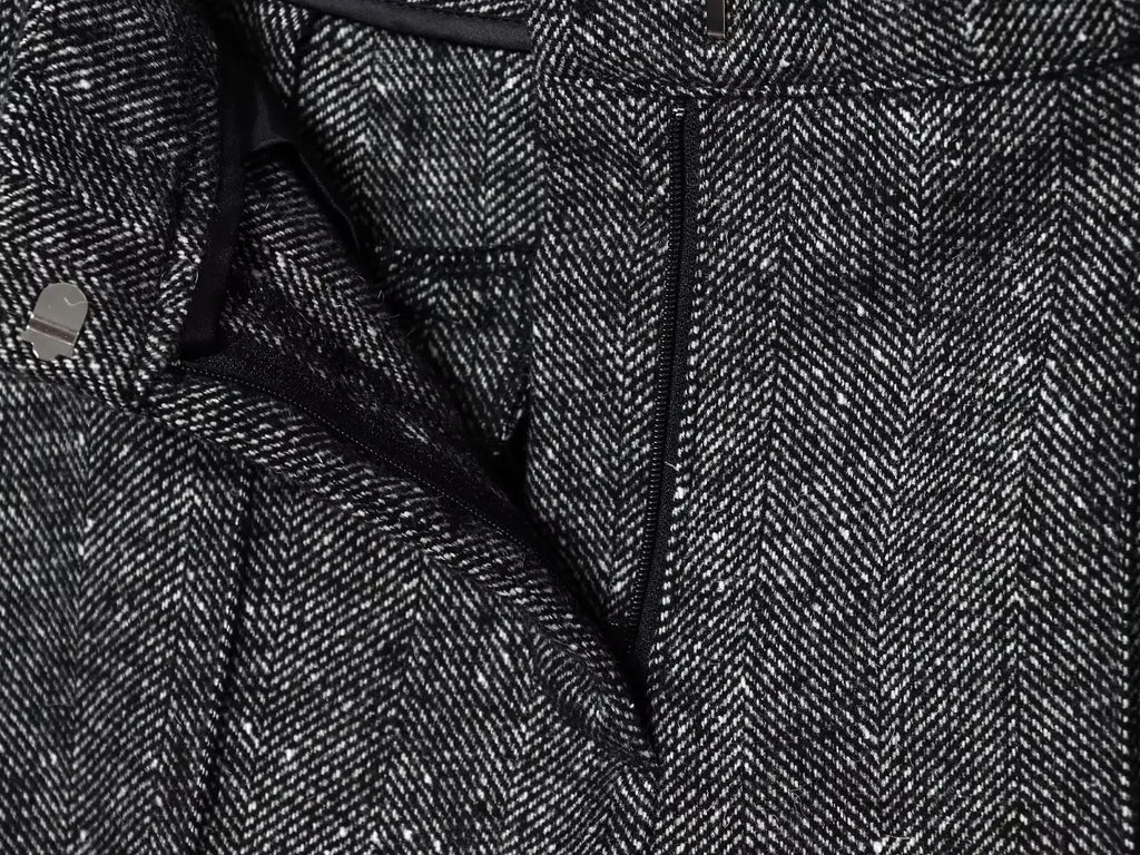 Close-up of a textured fabric with a herringbone pattern
