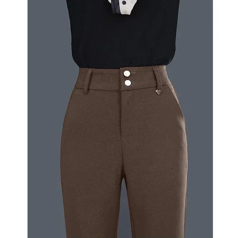 Brown pants with white buttons on a gray background