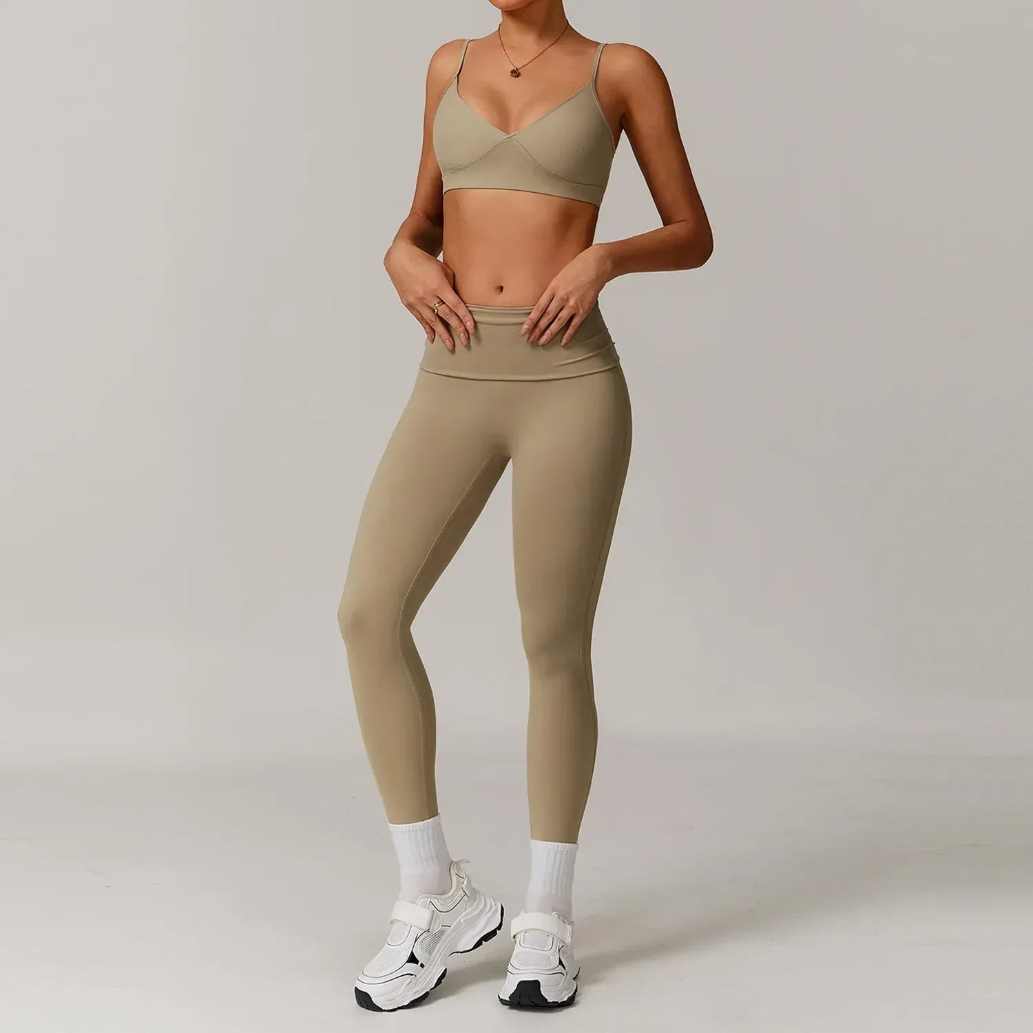Two-piece cream activewear set with a supportive push up sports bra and high-waisted contouring tight leggings - BetterPlace