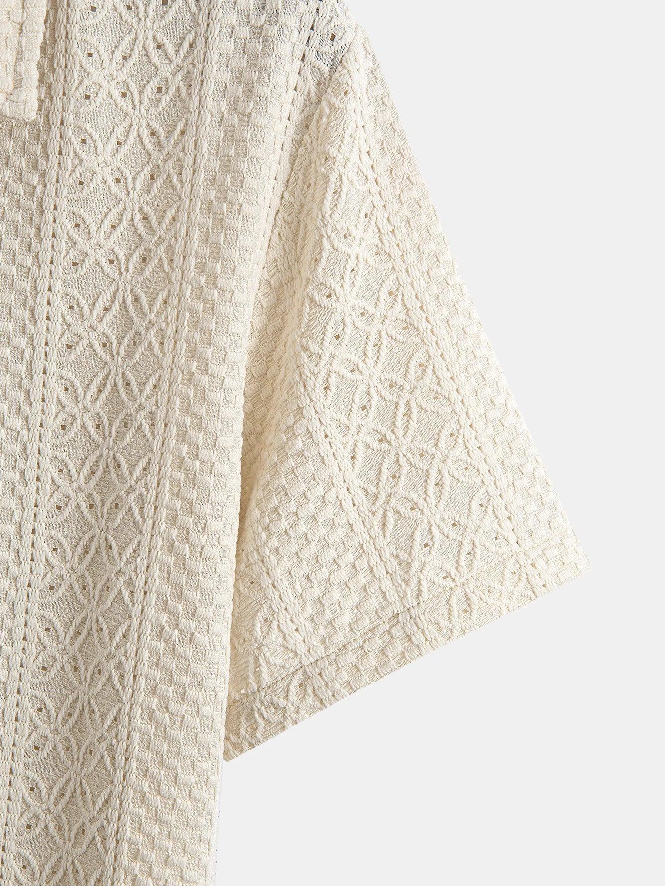 Close-up of a beige knitted fabric with a subtle pattern on a white background