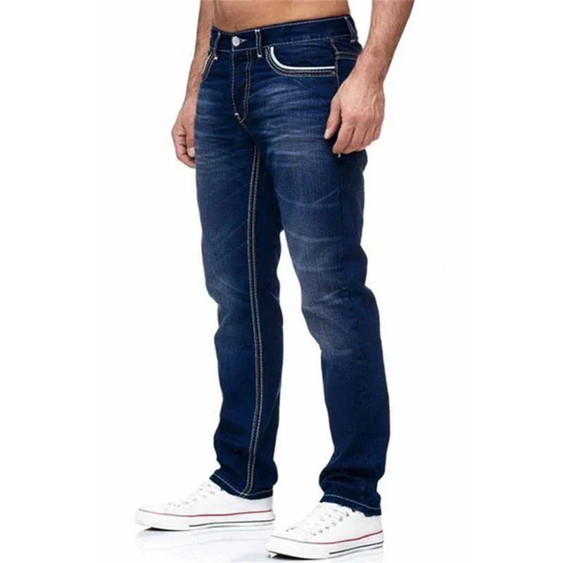 Blue jeans worn by a person on a white background