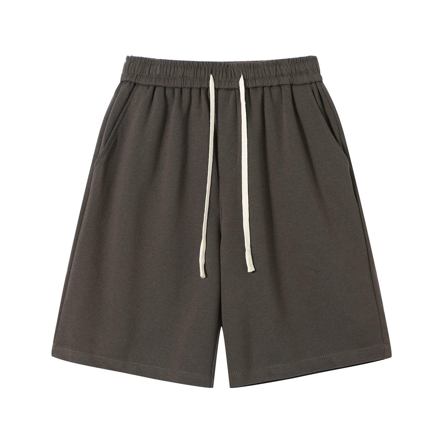 Dark gray shorts with a white drawstring on a white background