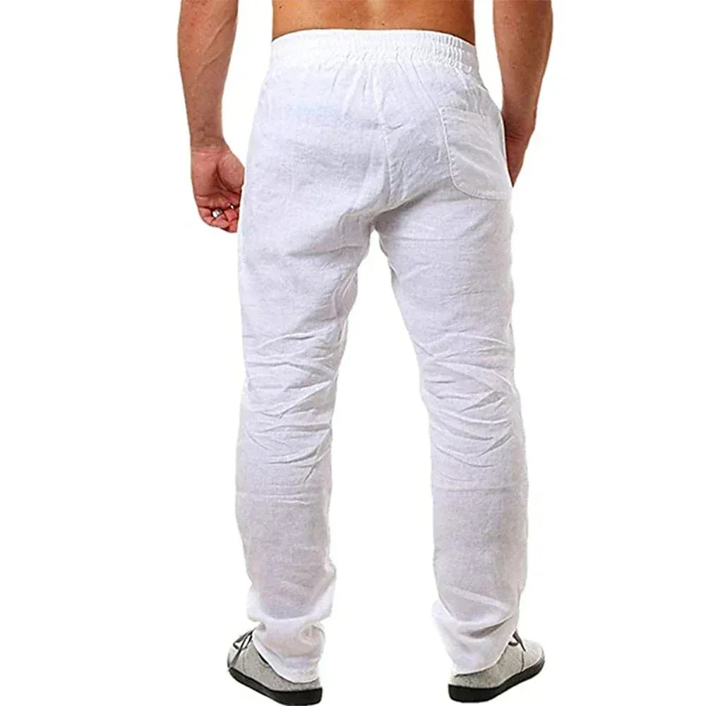 White pants worn by a person on a white background