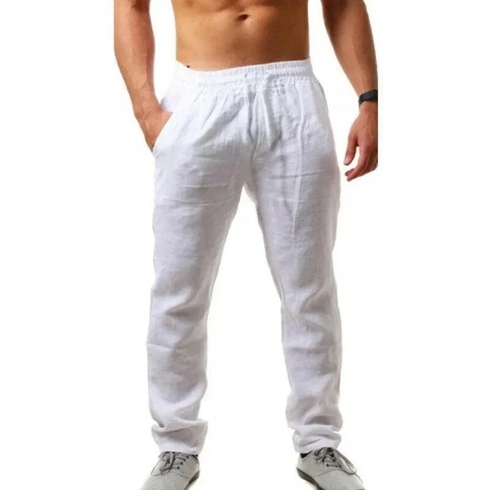 White linen pants worn by a person on a white background