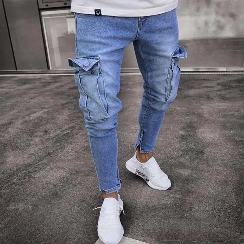 Person wearing blue ripped jeans and white sneakers on a gray floor.