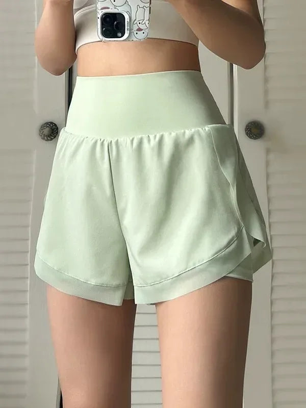 green Front view of women’s 2-in-1 running shorts showing the breathable outer layer and high-waisted fit - BetterPlace