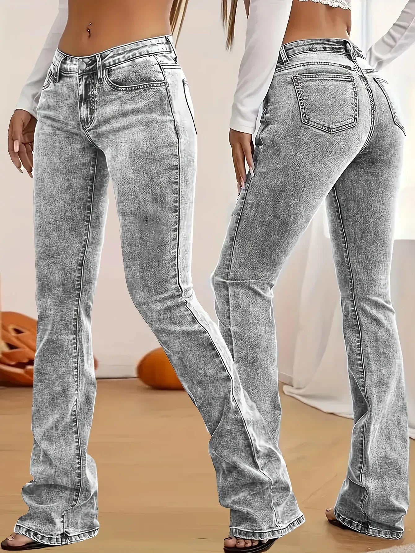 Gray acid-wash jeans worn by a person on a neutral background