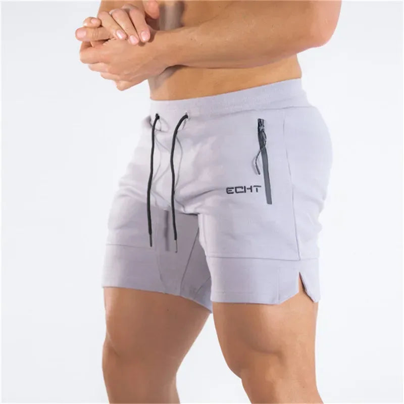 Light gray shorts with black drawstring and zipper pocket on a white background