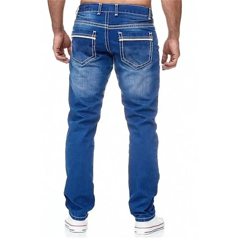 Blue jeans worn by a person on a white background