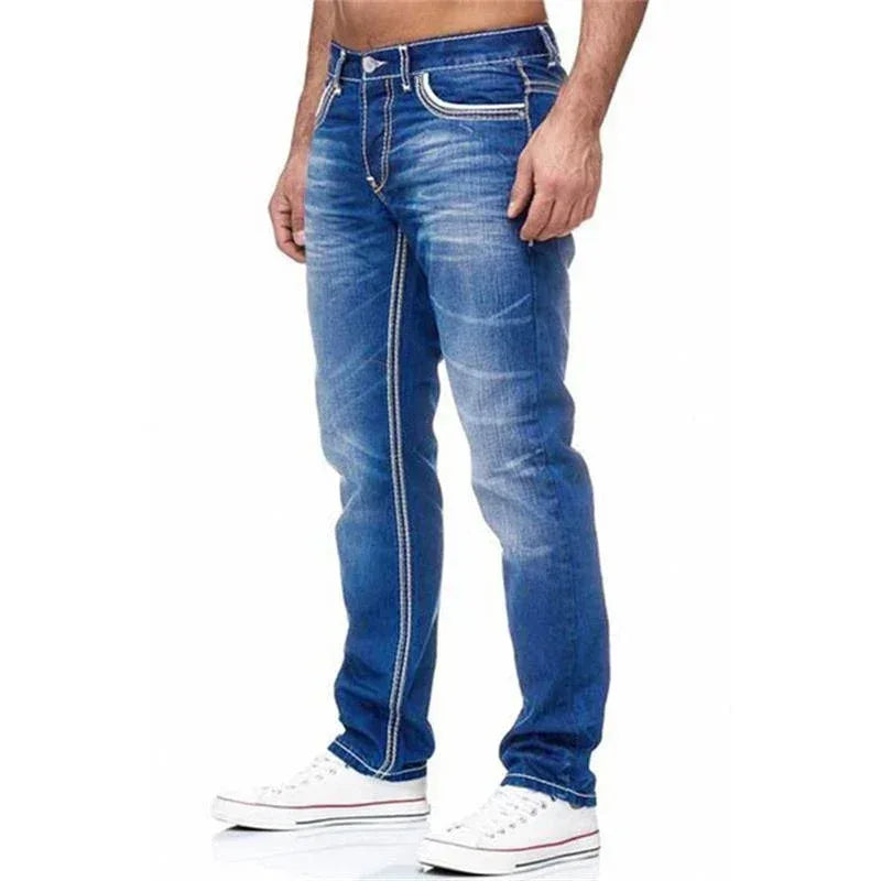 Blue jeans worn by a person on a white background