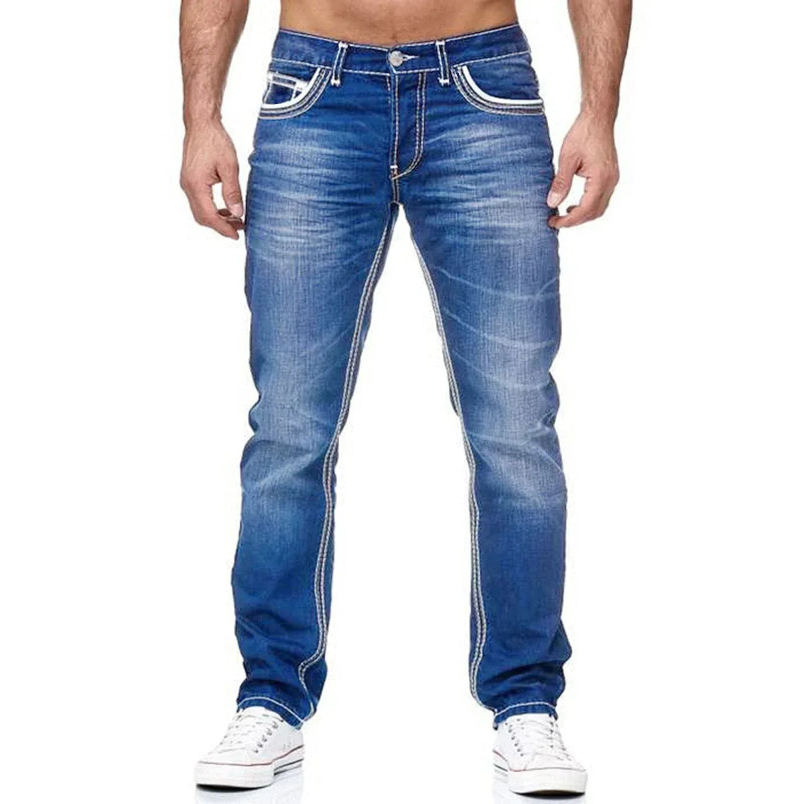 Blue jeans with white stitching worn by a person on a white background