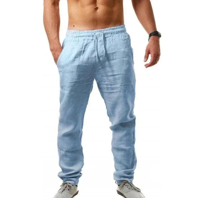 Light blue jogger pants worn by a person on a white background