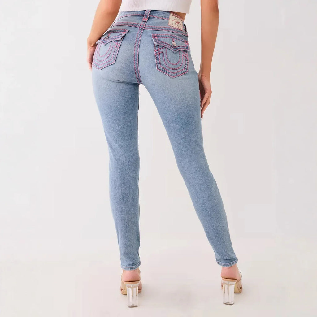 Light blue jeans worn by a person on a white background