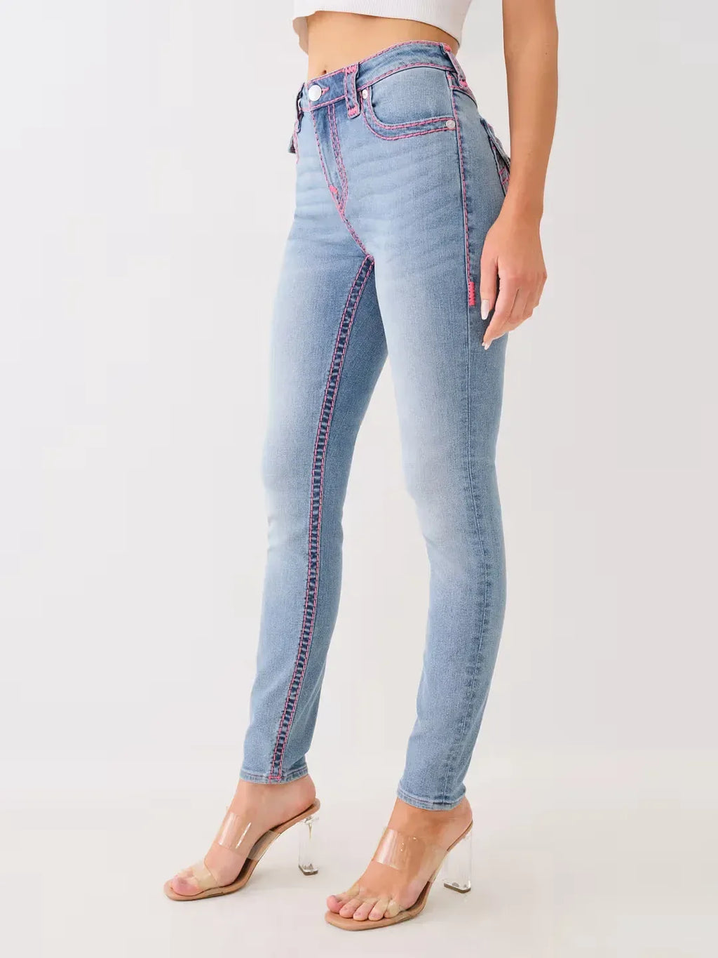 Light blue jeans worn by a person on a white background
