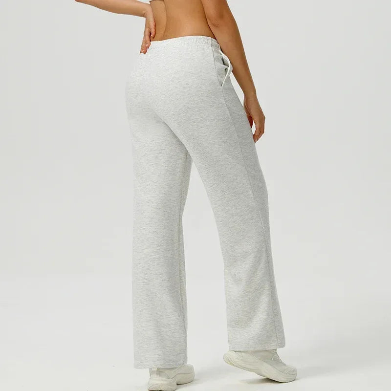 light gray Back view of women's oversized athletic sweatpants highlighting the high-rise waistband and relaxed fit - BetterPlace