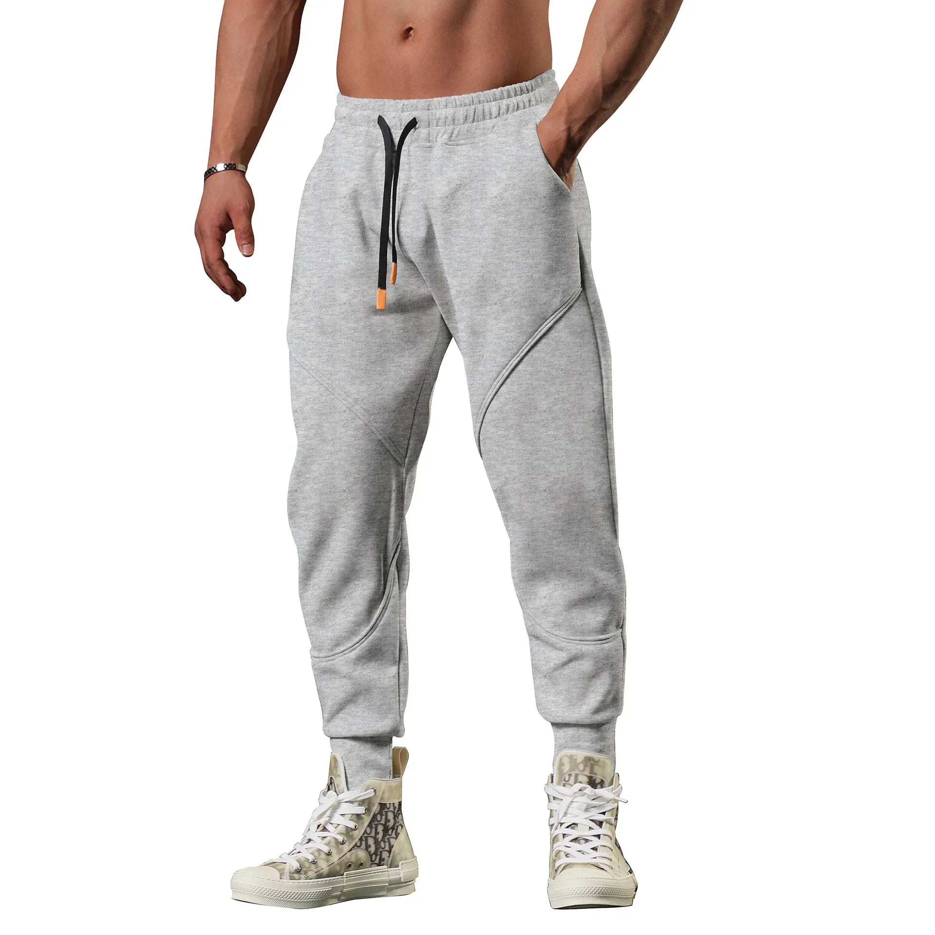 Gray jogger pants worn by a person on a white background