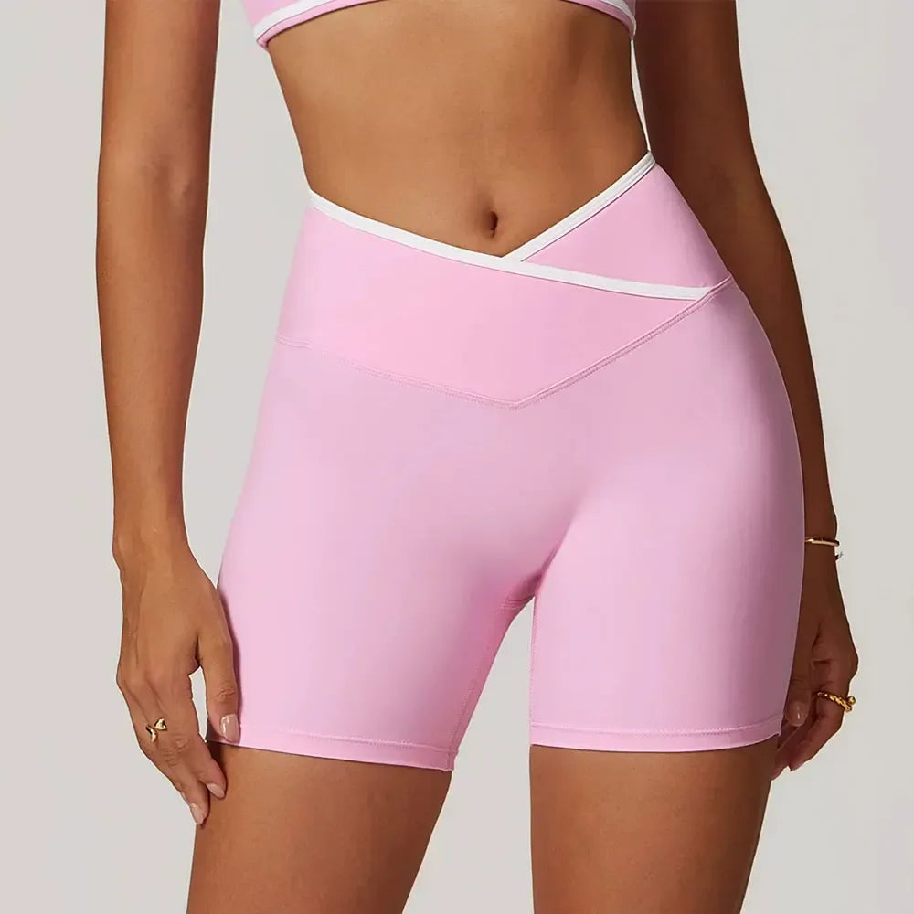 light pink Front view of women’s crossover high-waisted shorts featuring a slimming V-waist design - BetterPlace