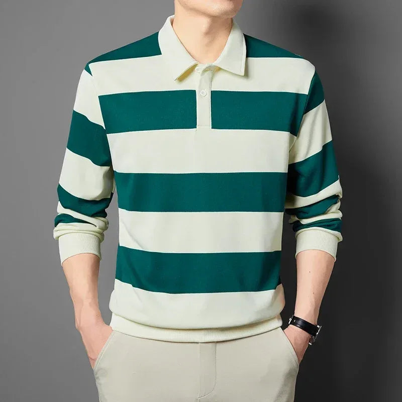 Green and white striped long-sleeve shirt worn by a person on a gray background
