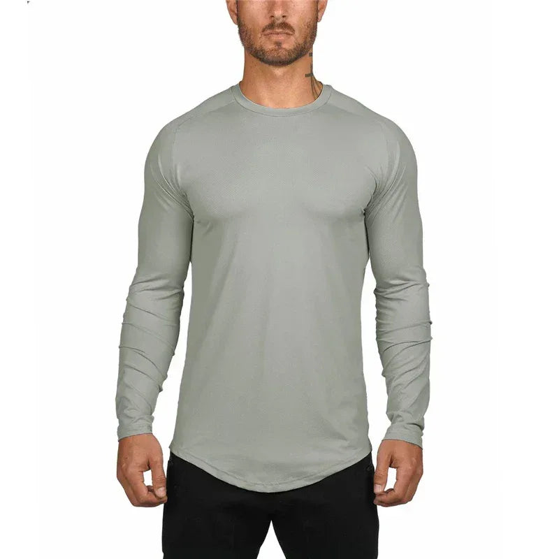 Man wearing a gray long-sleeve shirt on a white background