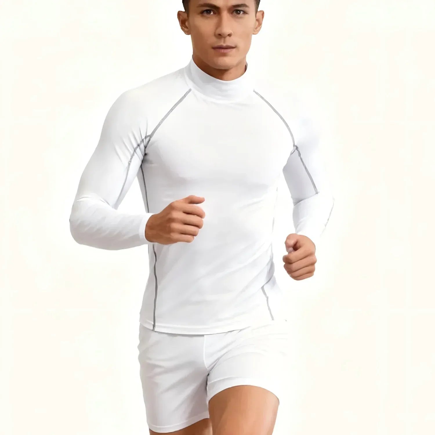 Man wearing a white long-sleeve athletic shirt and shorts on a light beige background