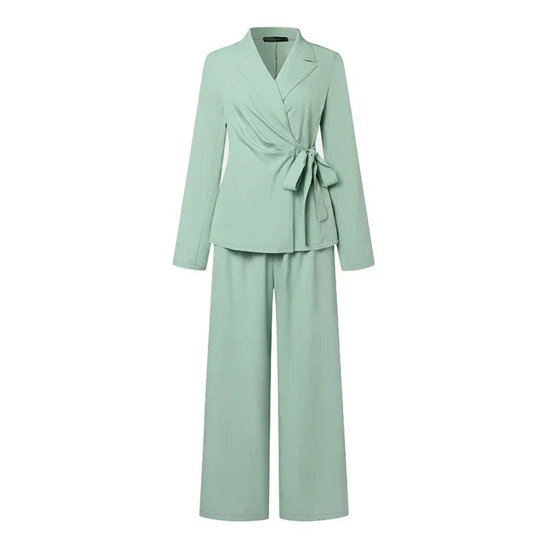 Mint green suit with a jacket and pants on a white background